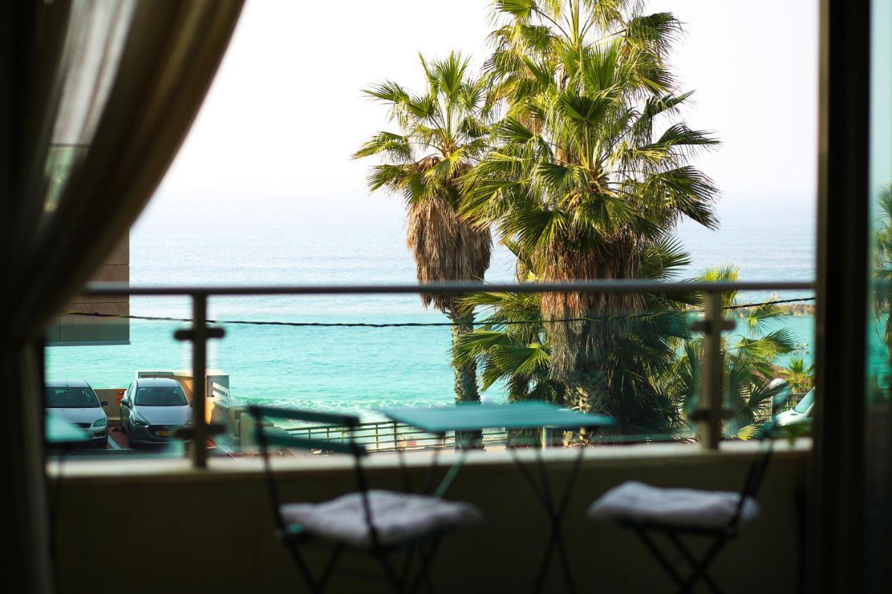 Balcony table with sea and palm view