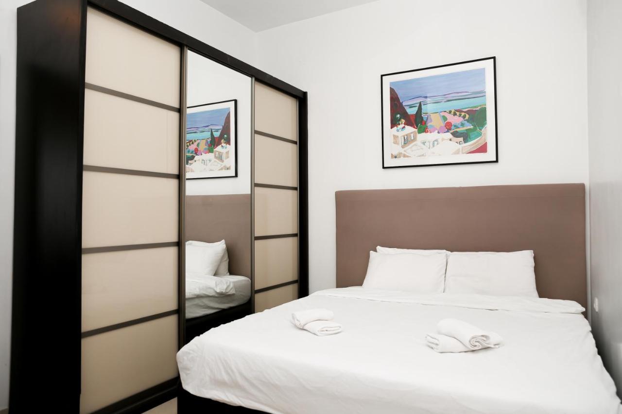 Second bedroom with bed and dark wood furniture