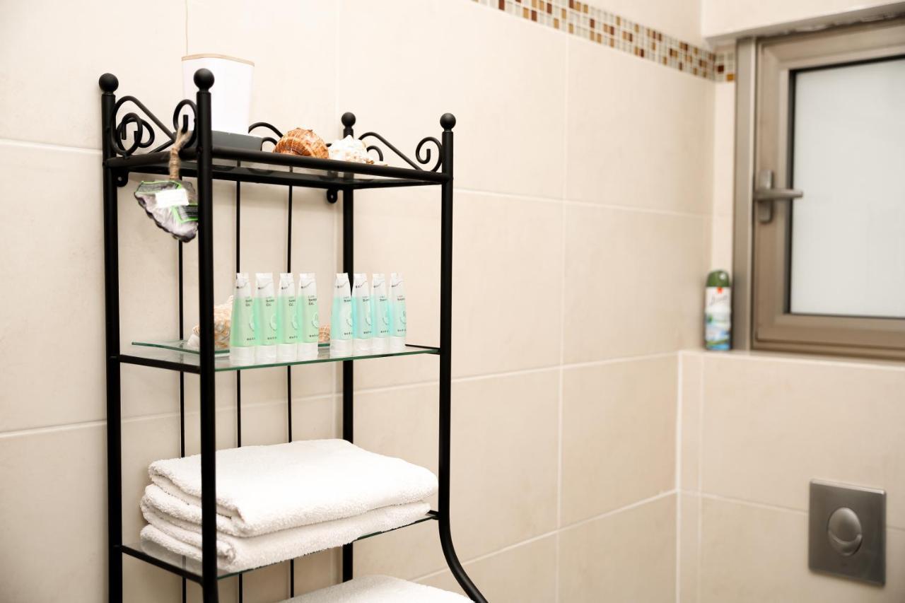 Bathroom amenities and towels at Sea View Apartment Prime Location